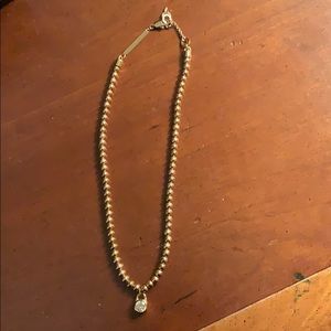 Rose gold Michael Kors pendant necklace.